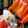 Ridwell employee sorting recyclables