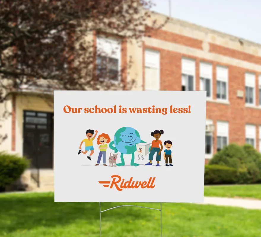 Ridwell yard sign in front of a school building.